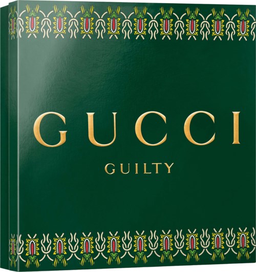 Gucci Guilty fragrance box with decorative pattern on a green background.