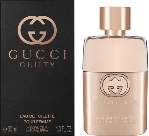 Een Gucci Guilty-parfumfles in zacht rosegoud met zwarte doos. De doos heeft gouden logo en tekst.
