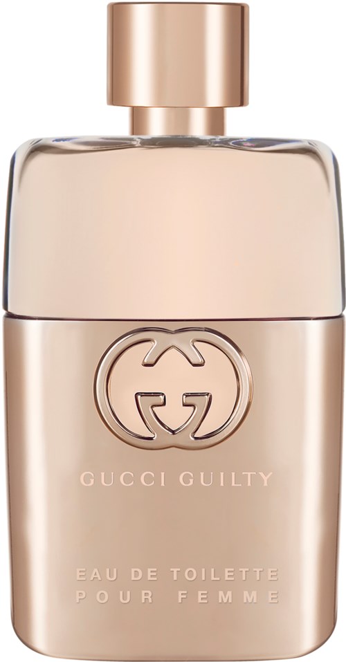 Een parfumfles met een gouden dop, lichtroze lichaam en Gucci Guilty-merk. Elegant en simpel ontwerp.