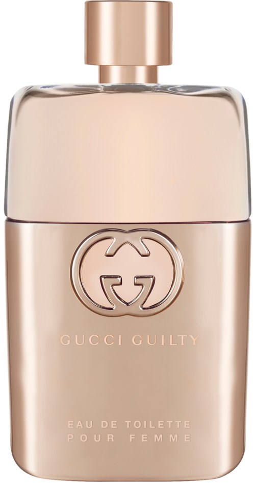 Een roze-beige parfumfles met een gouden dop en Gucci-logo, gemerkt 'Gucci Guilty' en 'Eau de Toilette'.
