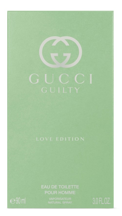 En grønn parfymeeske med Gucci-logo og ordene 'Guilty Love Edition' midt på.