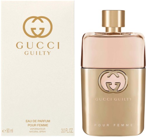 Een Gucci Guilty parfumfles en doos met gouden logo en tekst voor vrouwen.
