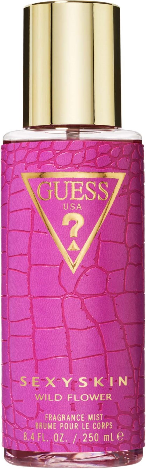 Roze flesje Guess parfum met gouden dop, met label Sexy Skin Wild Flower geurolie.