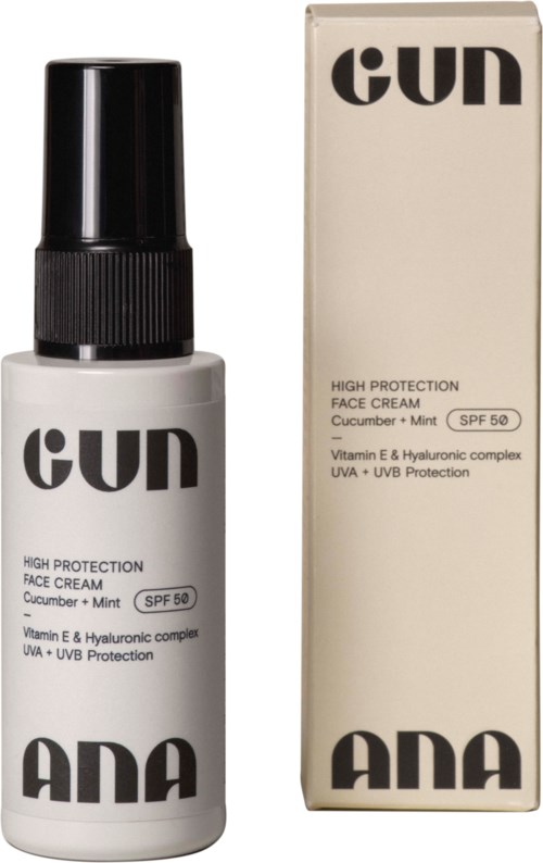 Een witte fles met zwarte dop, gemarkeerd "GUN" en "ANA," naast een wit doosje met vergelijkbare branding.