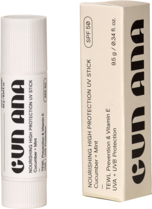 Lippenbalsemtube en doos met zonnebrandlabel, bevat SPF 50, vitamine E en tea tree olie.