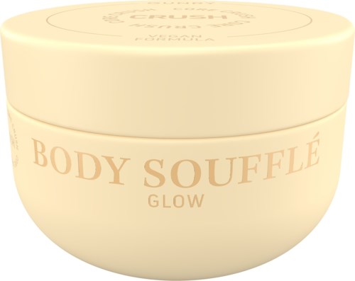 A round, cream-colored container with the words "Body Soufflé Glow" on it, likely a skin product.