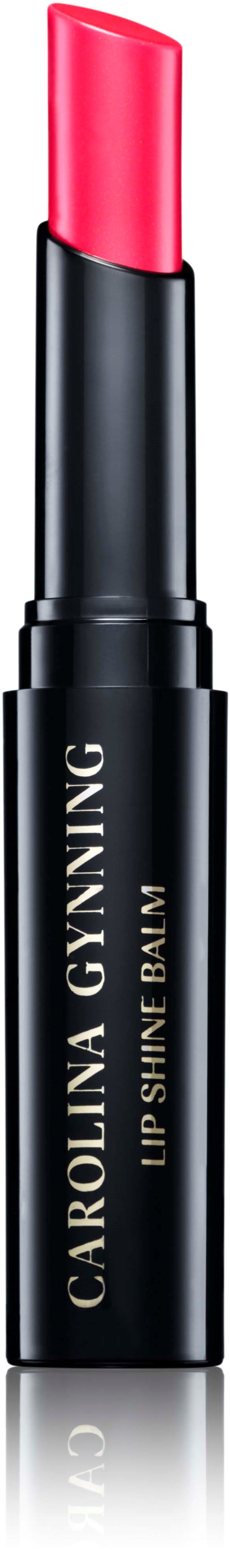 Ein Lippenstift mit rosa Lippenstift, beschriftet "Carolina Gynning Lip Shine Balm."