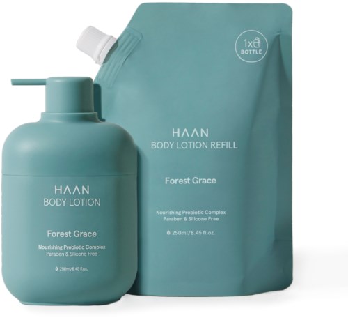 Eine türkise Flasche und Nachfüllbeutel von HAAN Forest Grace Körperlotion, als nährend und paraben- und silikonfrei gekennzeichnet.