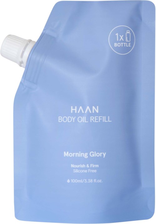 Blauwe navulverpakking voor lichaamsolie met witte dop, gemarkeerd 'Morning Glory' en 'Nourish & Firm'.
