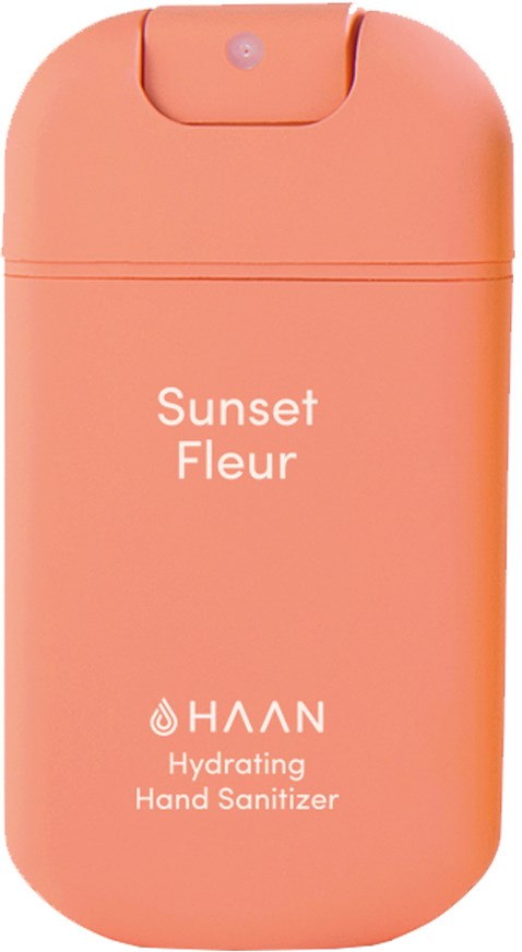 Eine rosa Verpackung mit der Aufschrift "Sunset Fleur" für feuchte Handdesinfektion, mit runder Oberseite und kleinem Knopf oder Sensor.