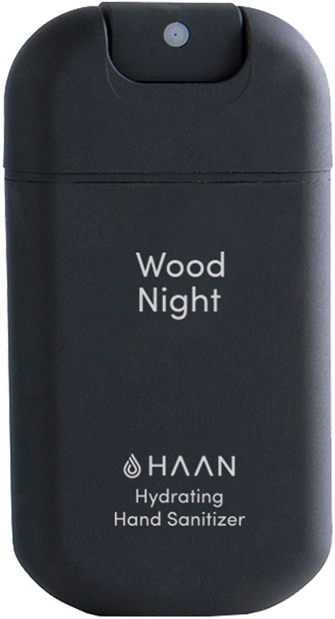 Eine kleine, schwarze Handdesinfektionsflasche mit der Beschriftung 'Wood Night' von HAAN, für unterwegs.