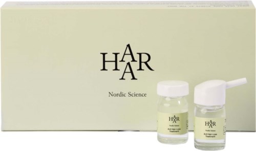 A skincare set with a box and two small bottles, one with a pump, labeled 'HÅR' and 'Nordic Science.'