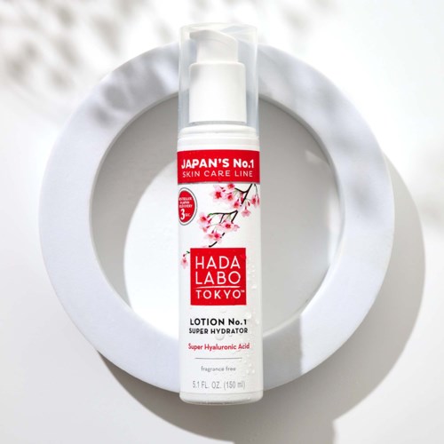 A white lotion bottle with red and pink design, labeled as Hada Labo Super Hydrator with hyaluronic acid.