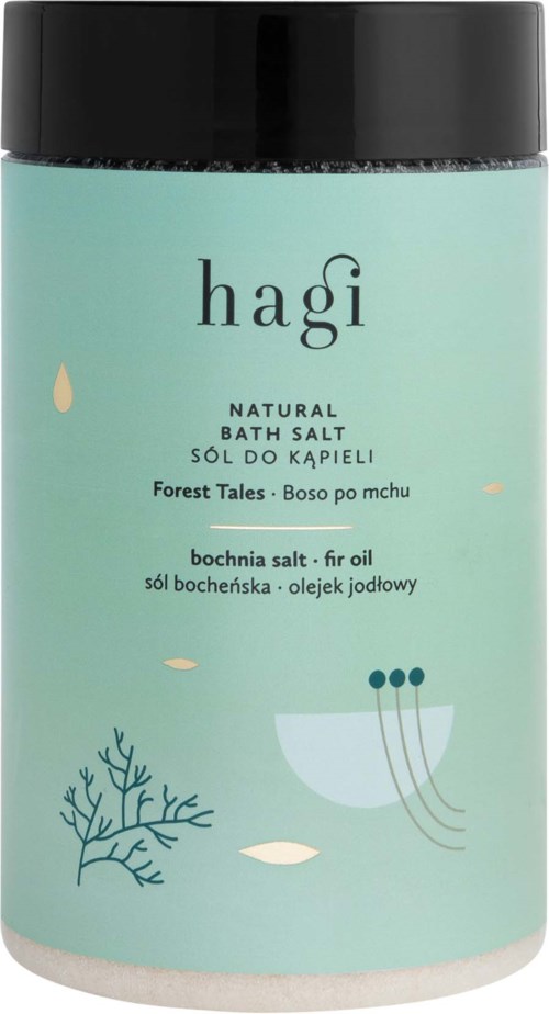 En turkis beholder med svart lokk, merket 'hagi' for bade salt, med minimalistiske hav- og planteillustrasjoner.