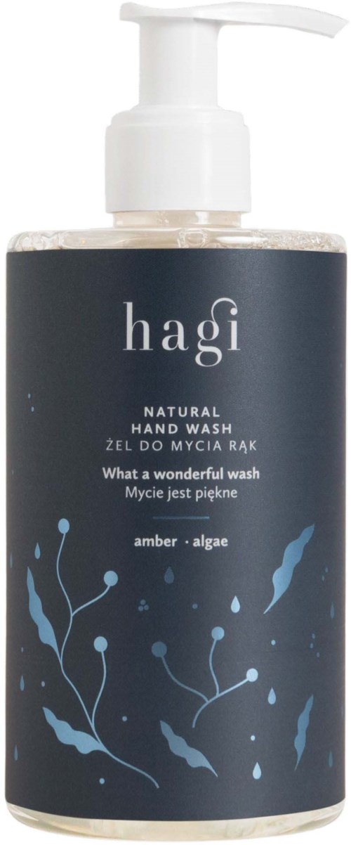 A bottle of natural hand wash with a pump, labeled 'hagi' and 'amber + algae' scent, featuring blue aquatic-themed design.