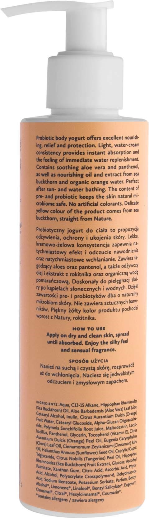 A tall, pink bottle with a white pump dispenser, containing lotion or body oil, with detailed text on the label.