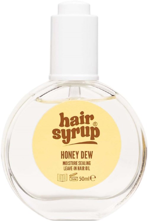 Round clear bottle with yellow label and white cap. Contains honey dew hair oil. Designed for hair care. 50 ml.