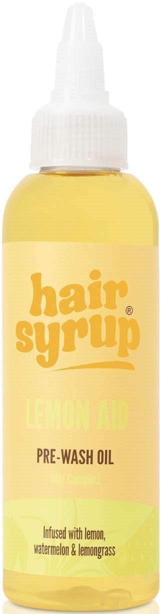 Gele fles met label 'hair syrup,' citroengeur, pre-wash olie met citroen, watermeloen en citroengras.