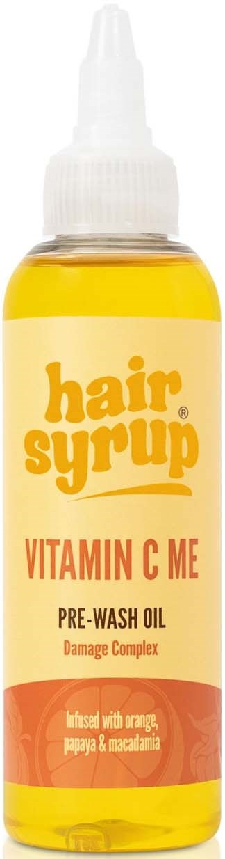 Klein geel flesje met haarbehandeling en witte spraydop, label zegt "hair syrup" en "Vitamin C ME."