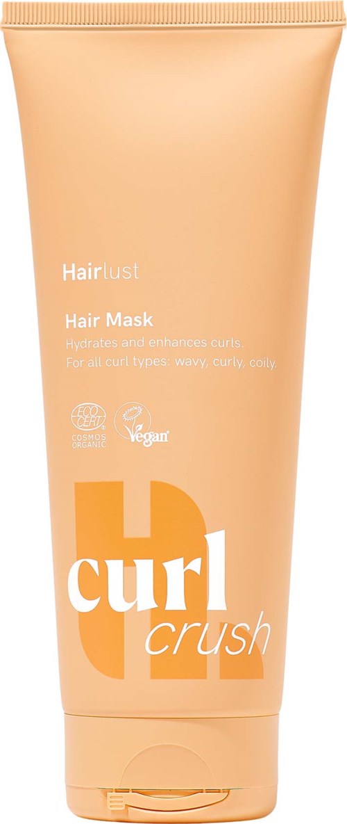 Ferskenfarget tube med Hair Lust Curl Crush hårkur, med lokk og produktinformasjon i hvitt og orange.