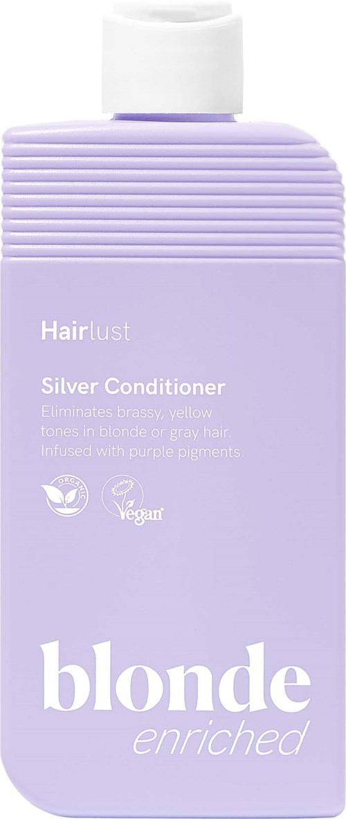 En lavendelfarget flaske av Hairlust Blonde Enriched Silver Conditioner med hvit tekst og skrukork.
