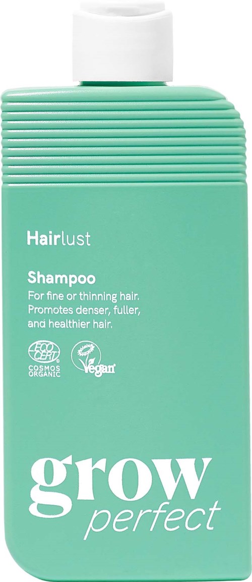 Green shampoo bottle with white cap, labeled Hairlust Grow Perfect for fine or thinning hair with eco and vegan icons.