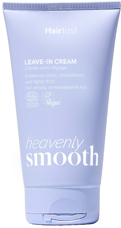 Light purple tube of leave-in cream for hair, labeled heavenly smooth, vegan, enhances shine and fights frizz.