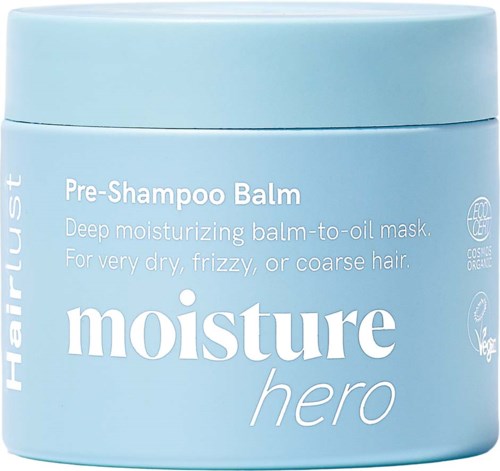 Lyseblå beholder med Moisture Hero Pre-Shampoo Balm for tørt, krusete eller grovt hår.