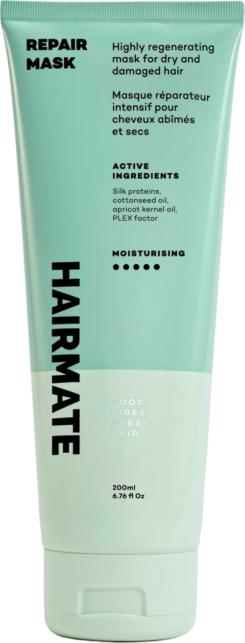 Een groene en witte tube haarmasker met tekst over herstel, ingrediënten en hydraterende voordelen.