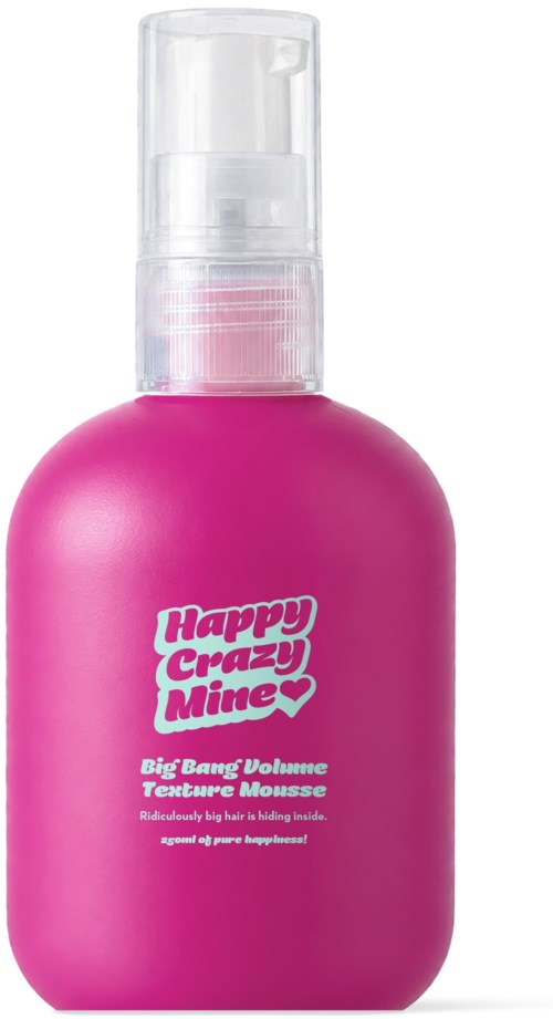 Pink bottle of Happy Crazy Mine Big Bang Volume Texturizing Mousse. Contains a pump spray at the top.