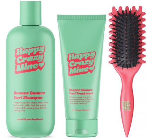 Drei Haarpflegeprodukte in grüner Verpackung: Shampoo, Conditioner und eine Haarbürste mit schwarzen und pinken Borsten.