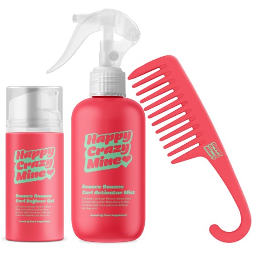 Ein rosa Haarstyling-Set mit Sprühflasche, Gelbehälter und Kamm, alles beschriftet 'Happy Crazy Mine'.