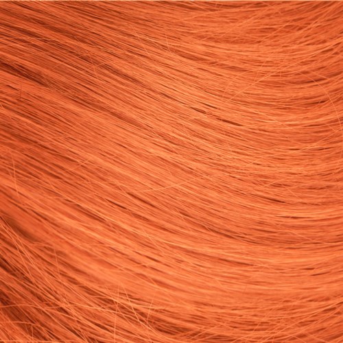Close-up of orange hair showing fine strands and smooth texture.