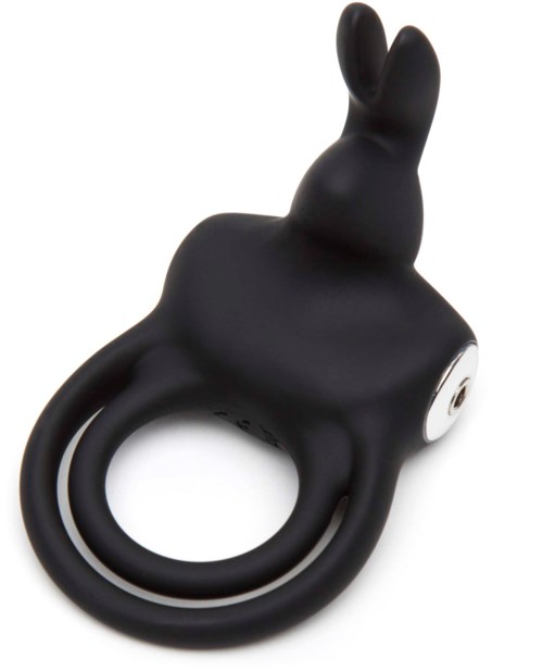 A black ring with a rabbit-shaped figure on top, possibly a wearable item or decorative piece.