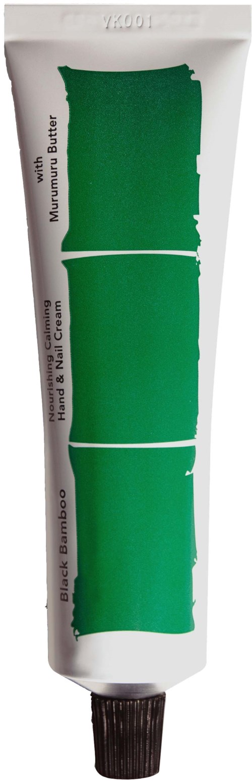 Green tube with black cap, labeled as hand cream with bamboo, nut butter, and shea ingredients.