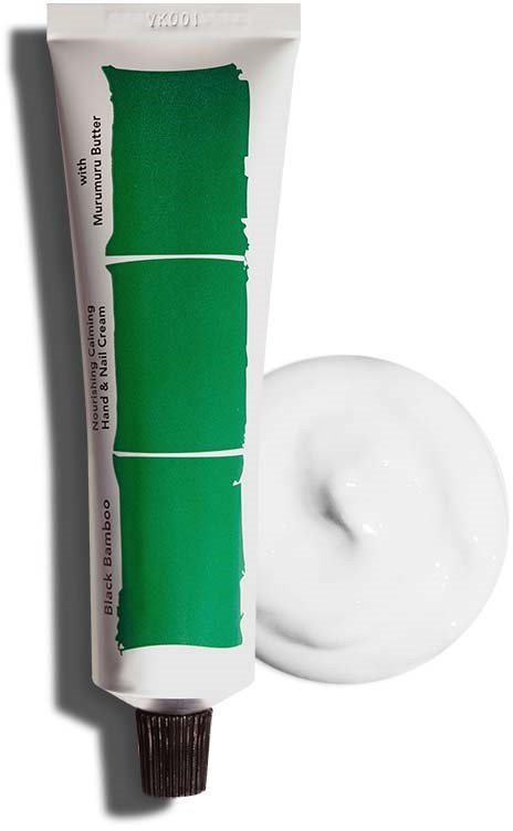 A tube of hand and nail cream with green design next to a dollop of white cream.