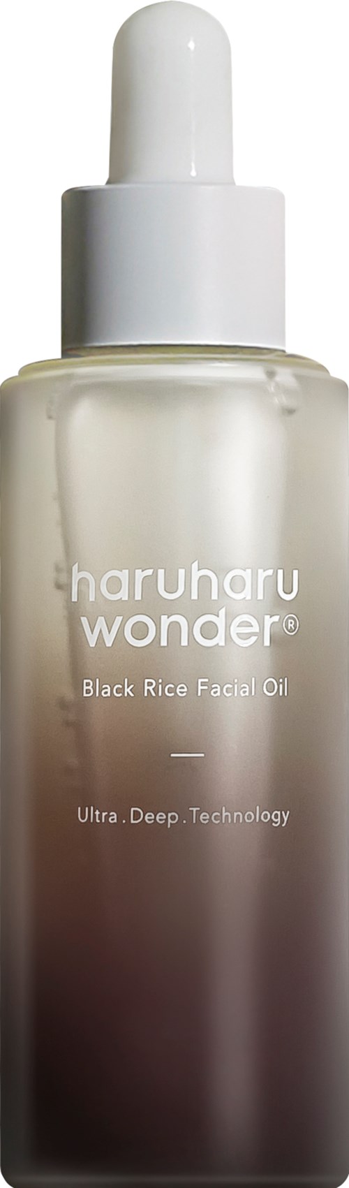 A bottle of facial oil with a white cap, labeled 'haruharu wonder Black Rice Facial Oil'.