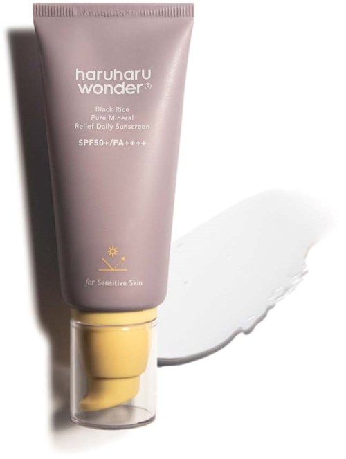 A tube of sunscreen labeled "Haruharu Wonder" with SPF50+. It has a yellow cap and is next to a smear of white sunscreen.