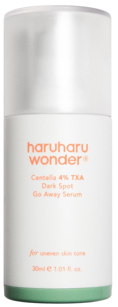 A white bottle with a silver cap, labeled 'haruharu wonder' for dark spot serum, suitable for uneven skin.