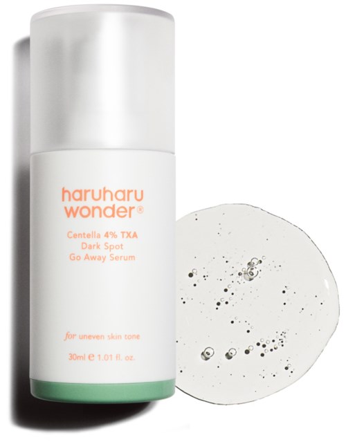 A skincare product bottle labeled Haruharu Wonder, with serum and a sample used around it.