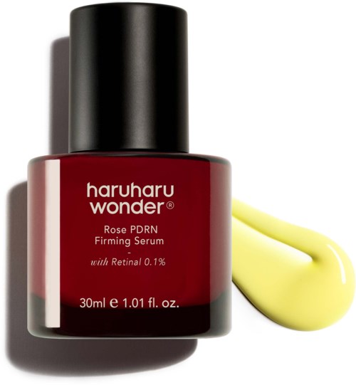 A red bottle of Haruharu Wonder Rose PDRN Ferming Serum with a yellow dollop beside it.