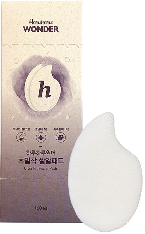 A facial pad with Korean writing and a water drop icon, labeled as ultra fit, shown with a soft, white pad.