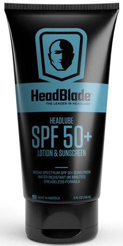 Musta putkilossa logo, tuotteen nimi, SPF 50+ aurinkovoide ja suojausohjeita pään ja ihon suojaamiseen.