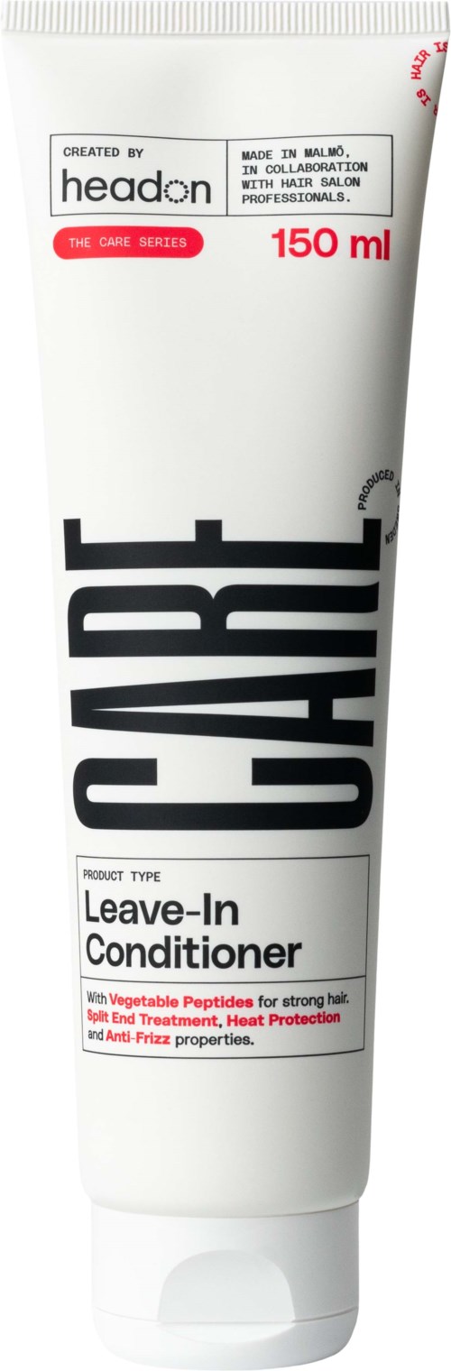 Witte tube met zwarte en rode tekst, gemarkeerd als leave-in conditioner voor haarbehandeling.