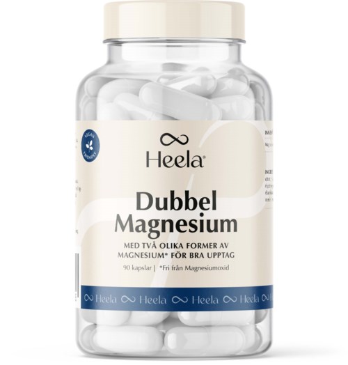 Flaska med Heela Dubbel Magnesium-kapslar, vita kapslar, etikett på svenska, nämner magnesiumupptag.