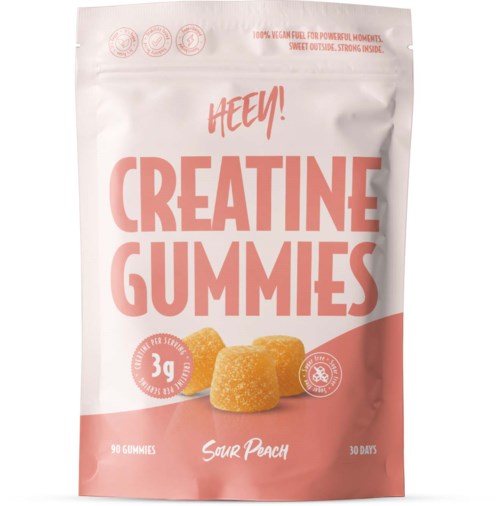 Förpackning för sour peach smaksatta kreatin-gummies med rosa och vit design, visar tre gummies och produktdetaljer.