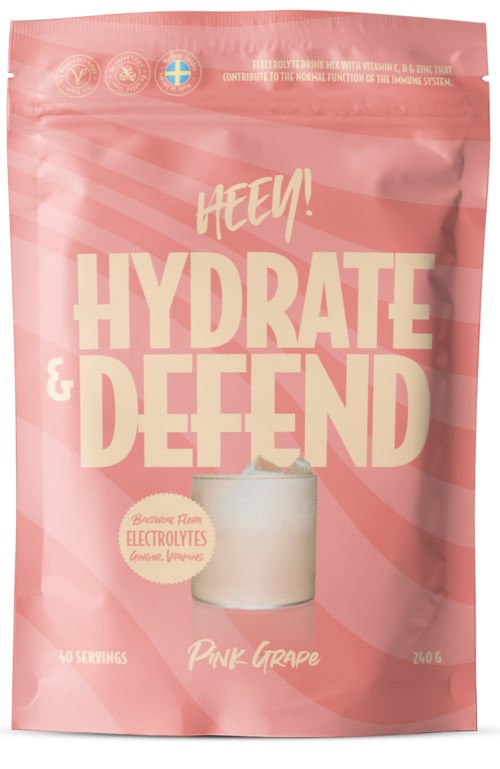 Pinke Packung mit großem Text 'HYDRATE & DEFEND' und einem Glas mit rosa Getränk.