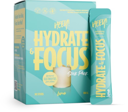 Eine hellblaue Schachtel mit gelbem Text "HYDRATE & FOCUS" und einem Zitronengeschmack-Stickpack innen.
