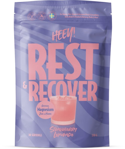 Package with pink text, showing a strawberry lemonade drink and information about magnesium and servings.