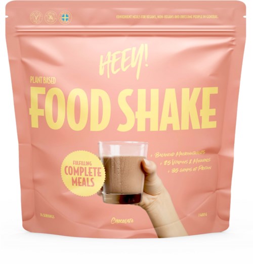 Pink packaging with a hand holding a glass of chocolate food shake, labeled as plant-based and complete meal.